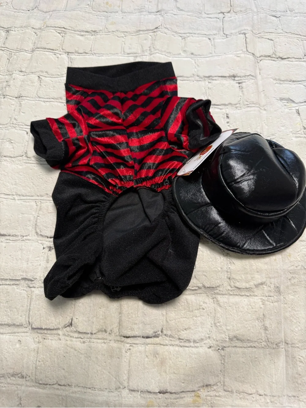 Pet warrior Dog striped red and black shirt and black pants. Halloween custome.